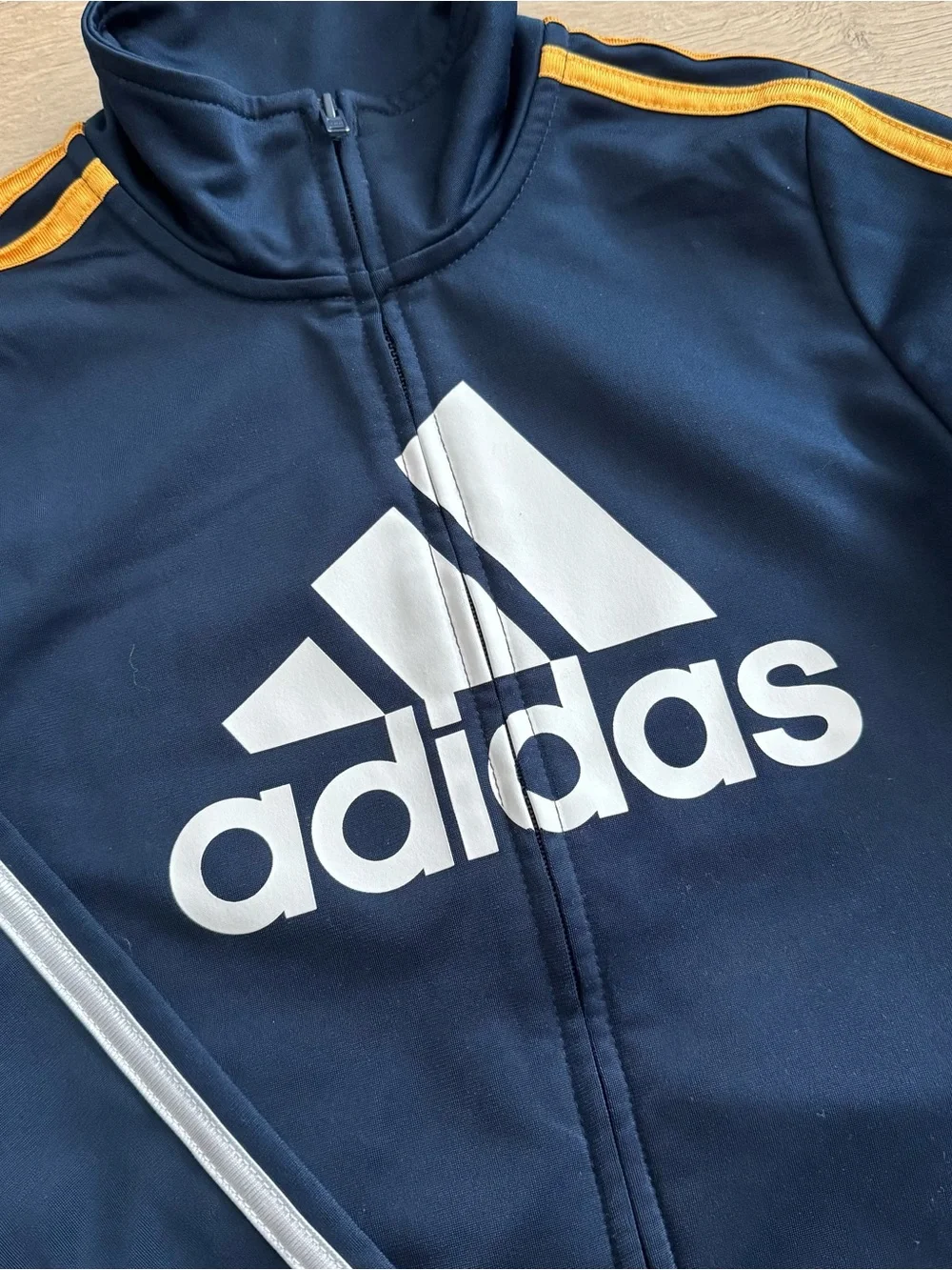 adidas kids Navy track Jacket with White Logo and Gold Shoulder Stripes